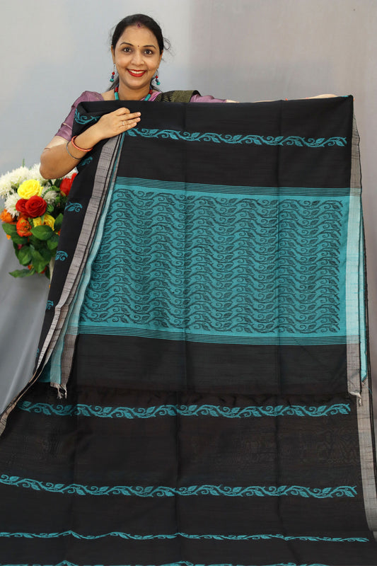 "Graceful handloom saree, exuding charm in classic black."