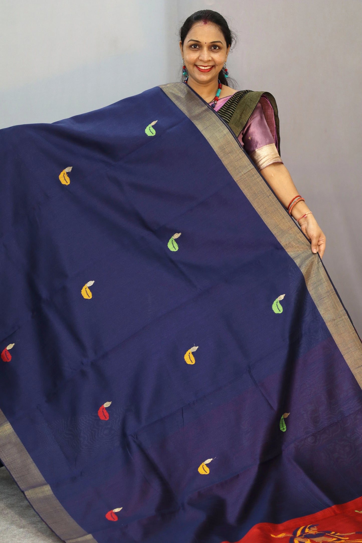 "Elegant navy blue hand-woven saree, crafted with intricate artistry."