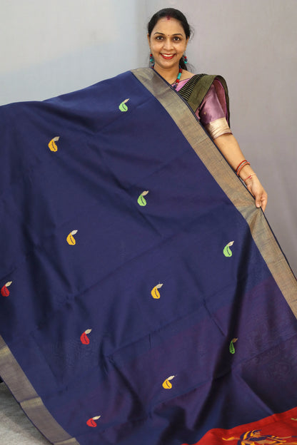 "Elegant navy blue hand-woven saree, crafted with intricate artistry."