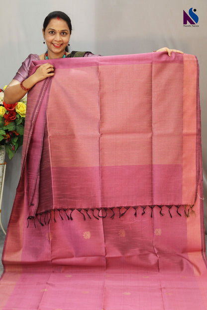 Delicate light pink tone enhanced with intricate handwoven detailing saree