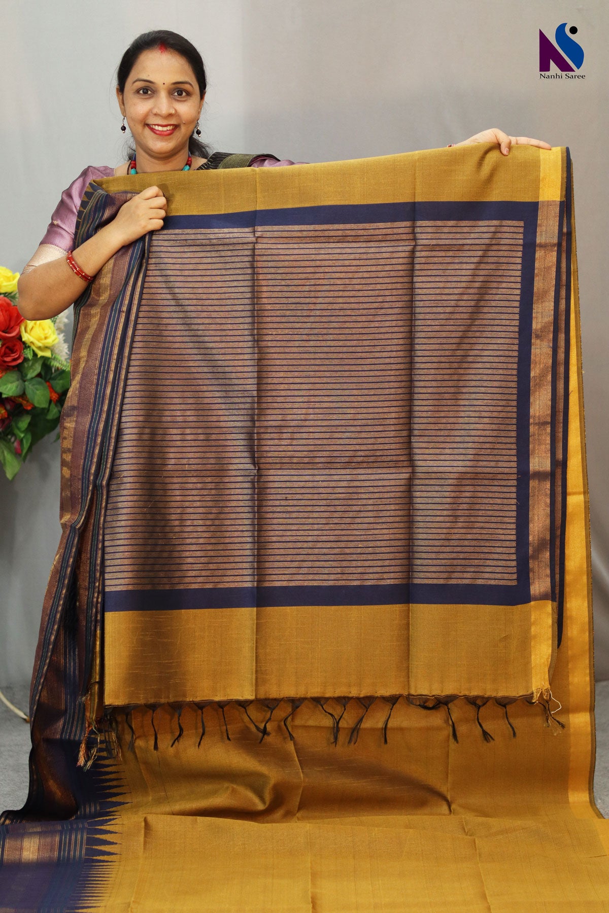Earthy mustard tones woven in a graceful traditional handloom drape