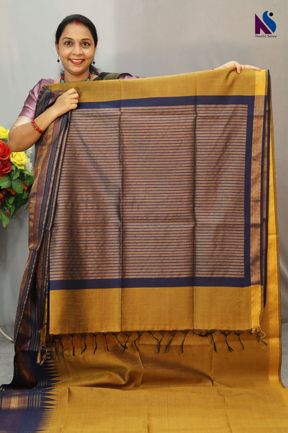 Earthy mustard tones woven in a graceful traditional handloom drape