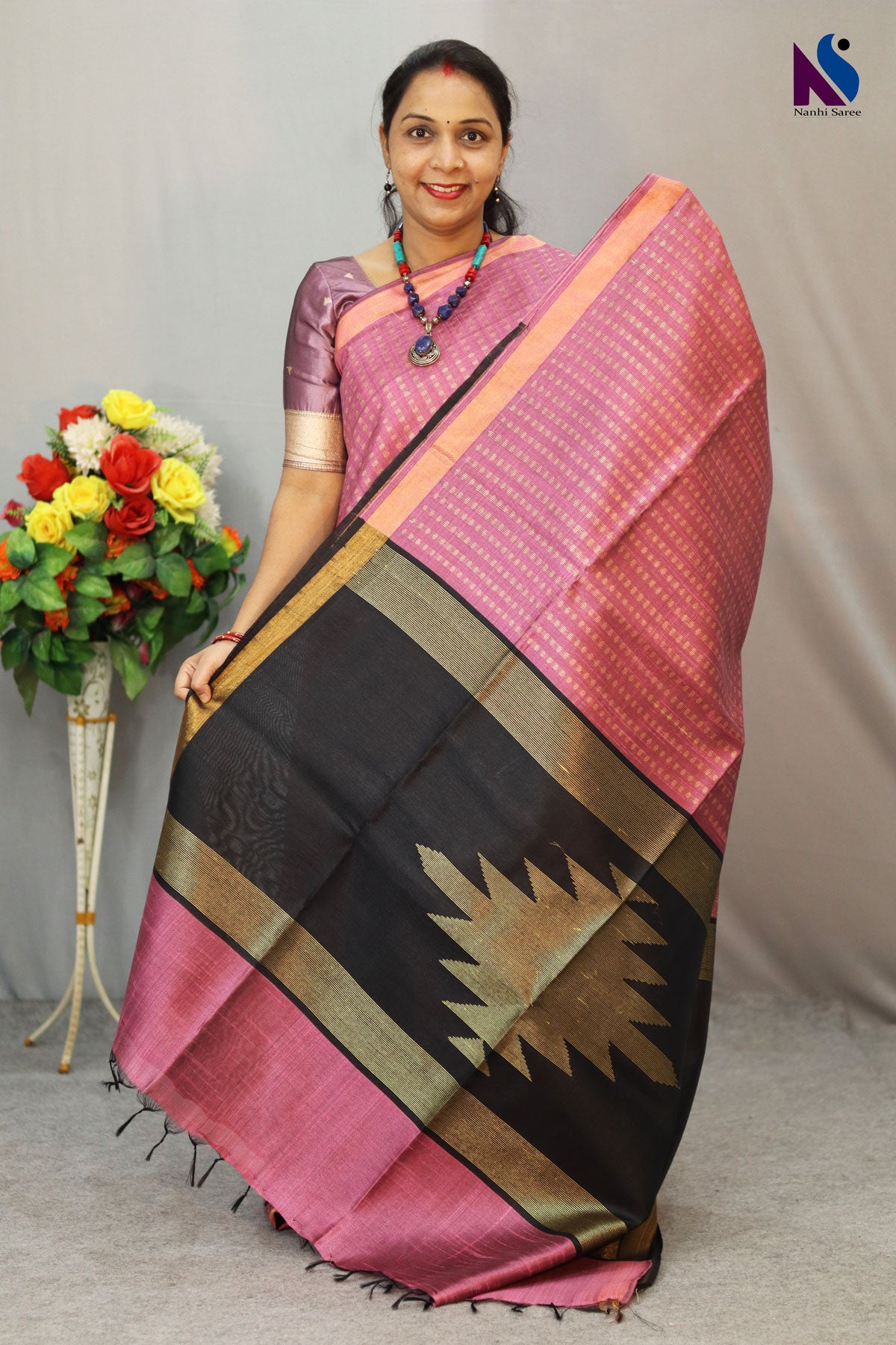 A charming English pink handloom creation designed for effortless elegance