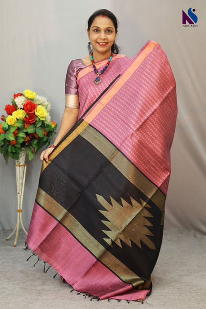 A charming English pink handloom creation designed for effortless elegance