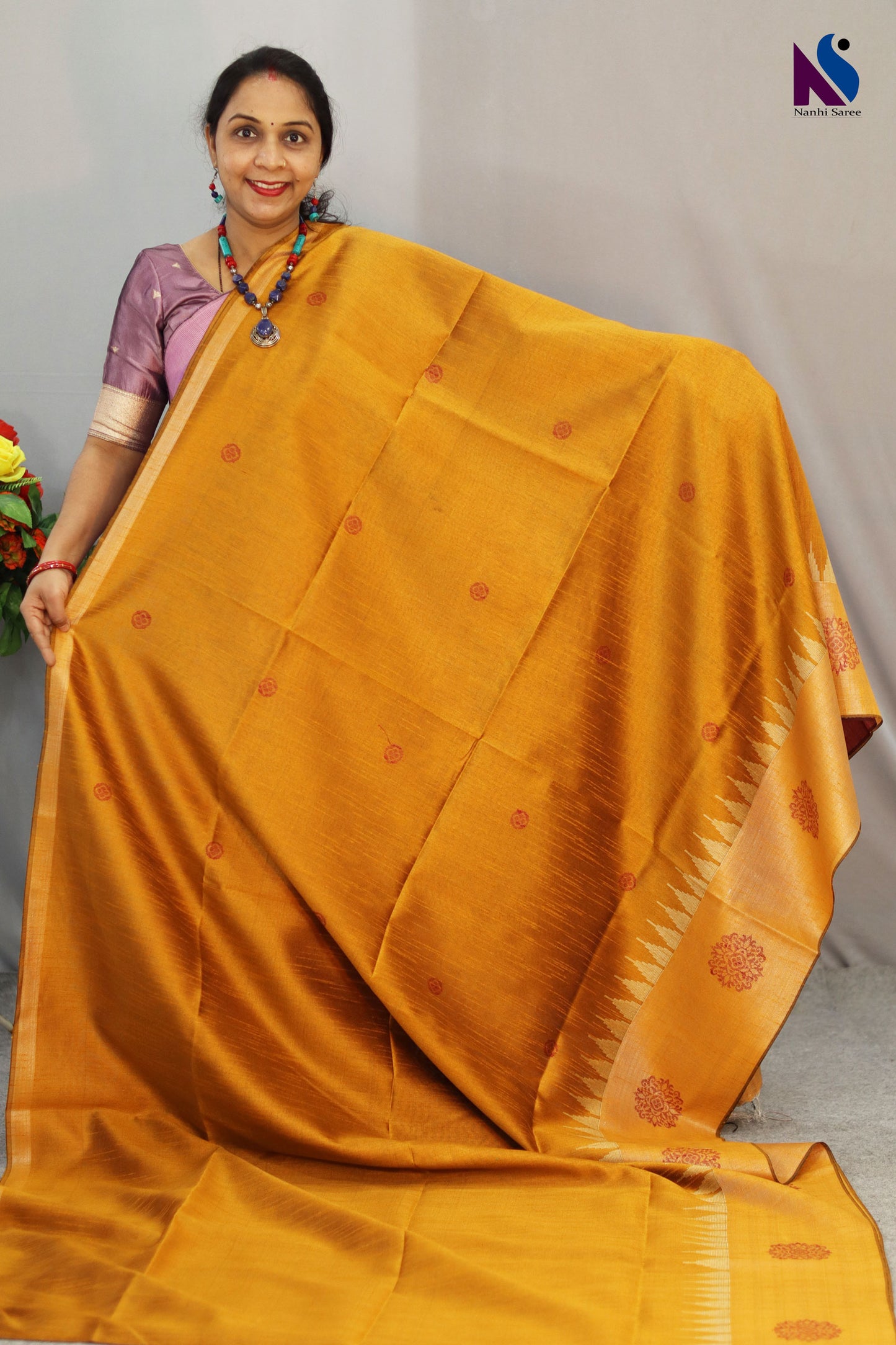 Bright turmeric yellow handloom saree showcasing elegant craftsmanship