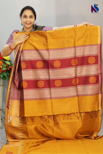 Bright turmeric yellow handloom saree showcasing elegant craftsmanship