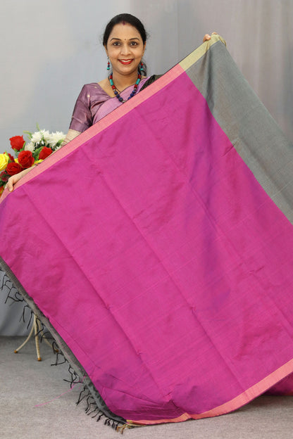 Handwoven gray art silk saree with soft yet striking pink pallu