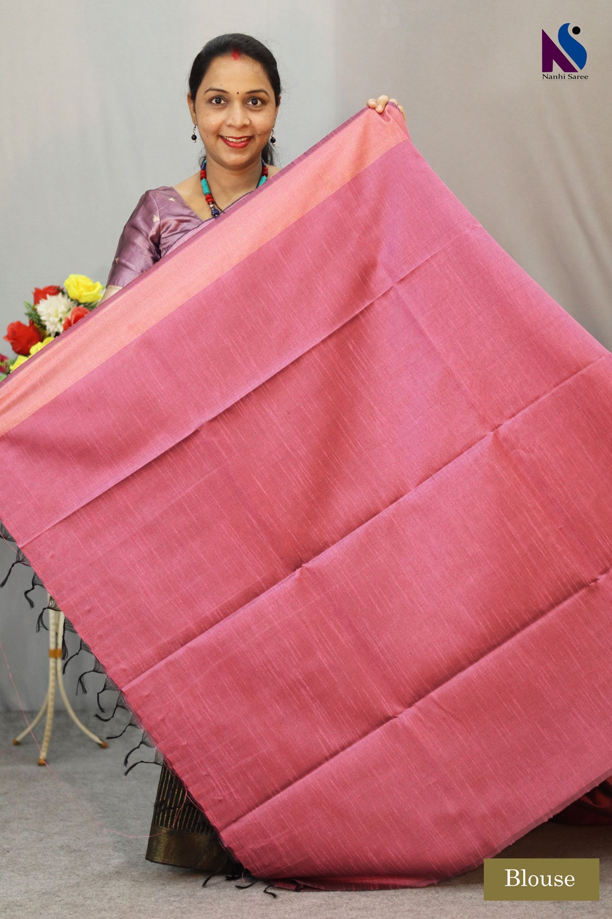 Delicate light pink tone enhanced with intricate handwoven detailing saree
