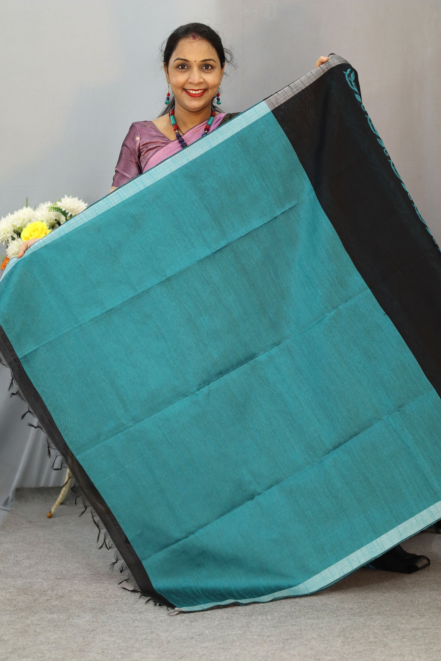 "Graceful handloom saree, exuding charm in classic black."