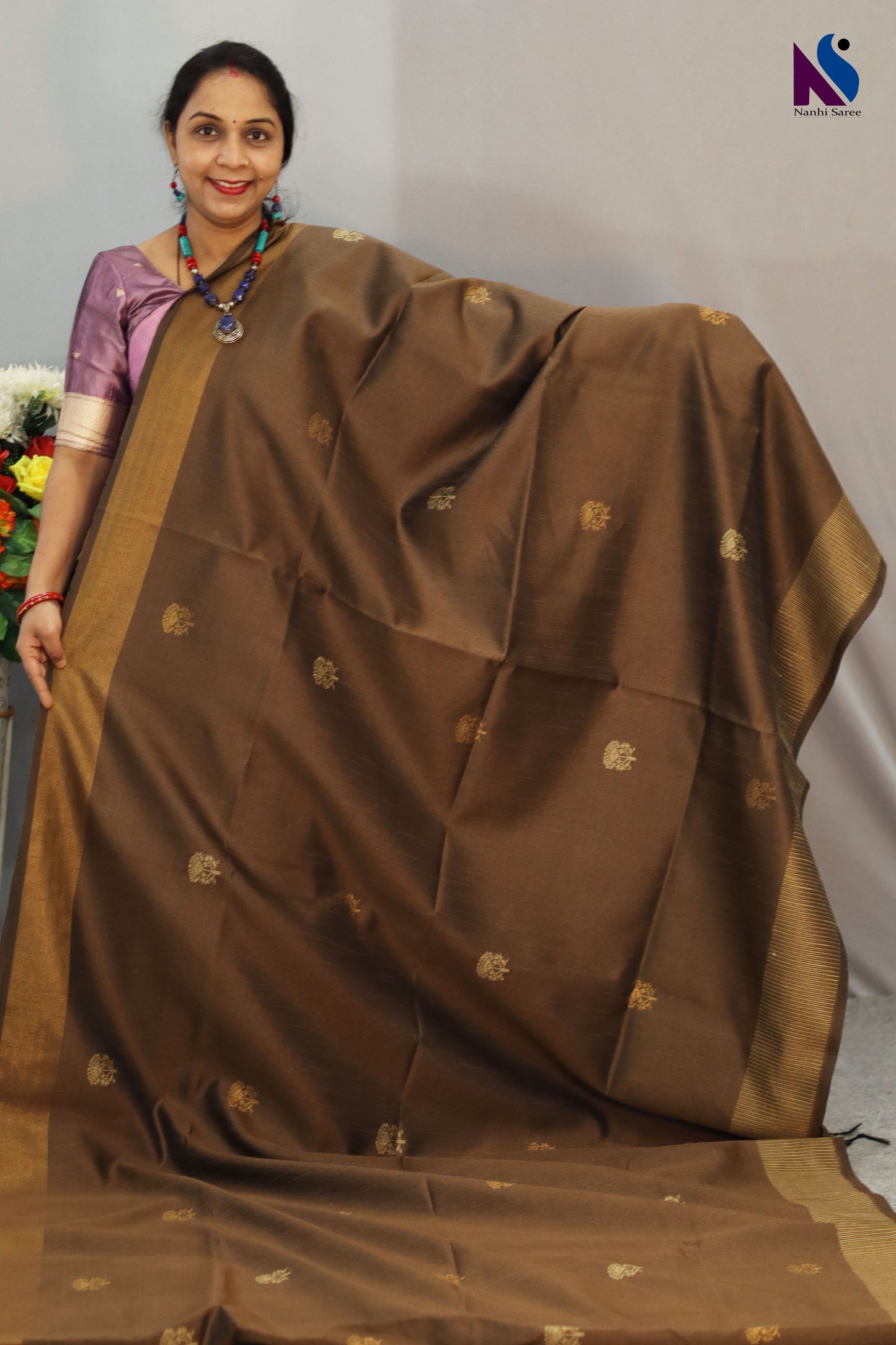 Graceful light brown handloom saree with soft traditional weave