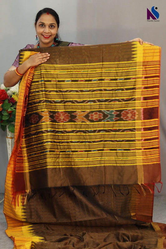 Heritage-inspired yellow Pochampally patterns adorn this elegant light brown handloom saree