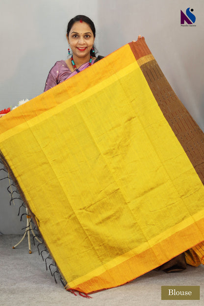 Heritage-inspired yellow Pochampally patterns adorn this elegant light brown handloom saree