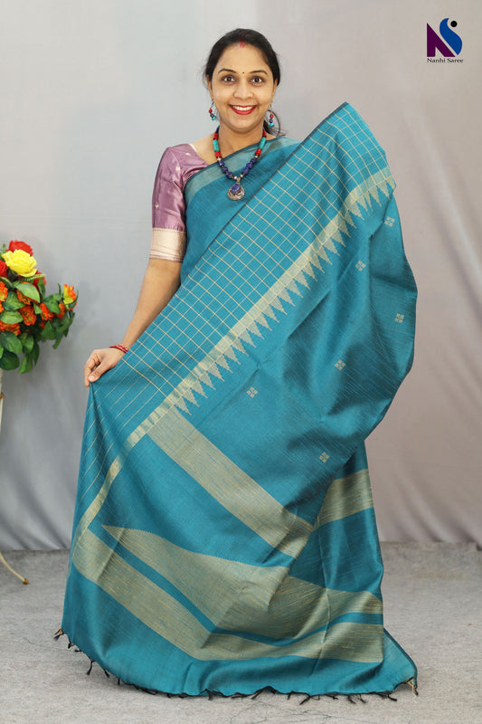 A beautifully woven handloom saree in soothing turquoise hues