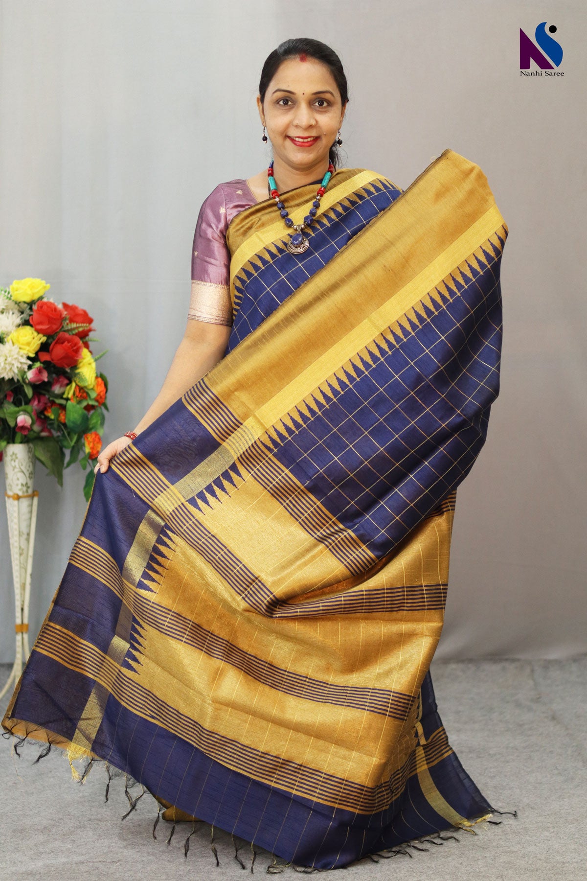 Classic golden and deep blue blend with timeless handwoven artistry saree