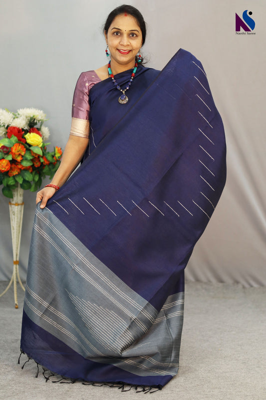 A handloom saree featuring rich navy blue tones and fine weaving