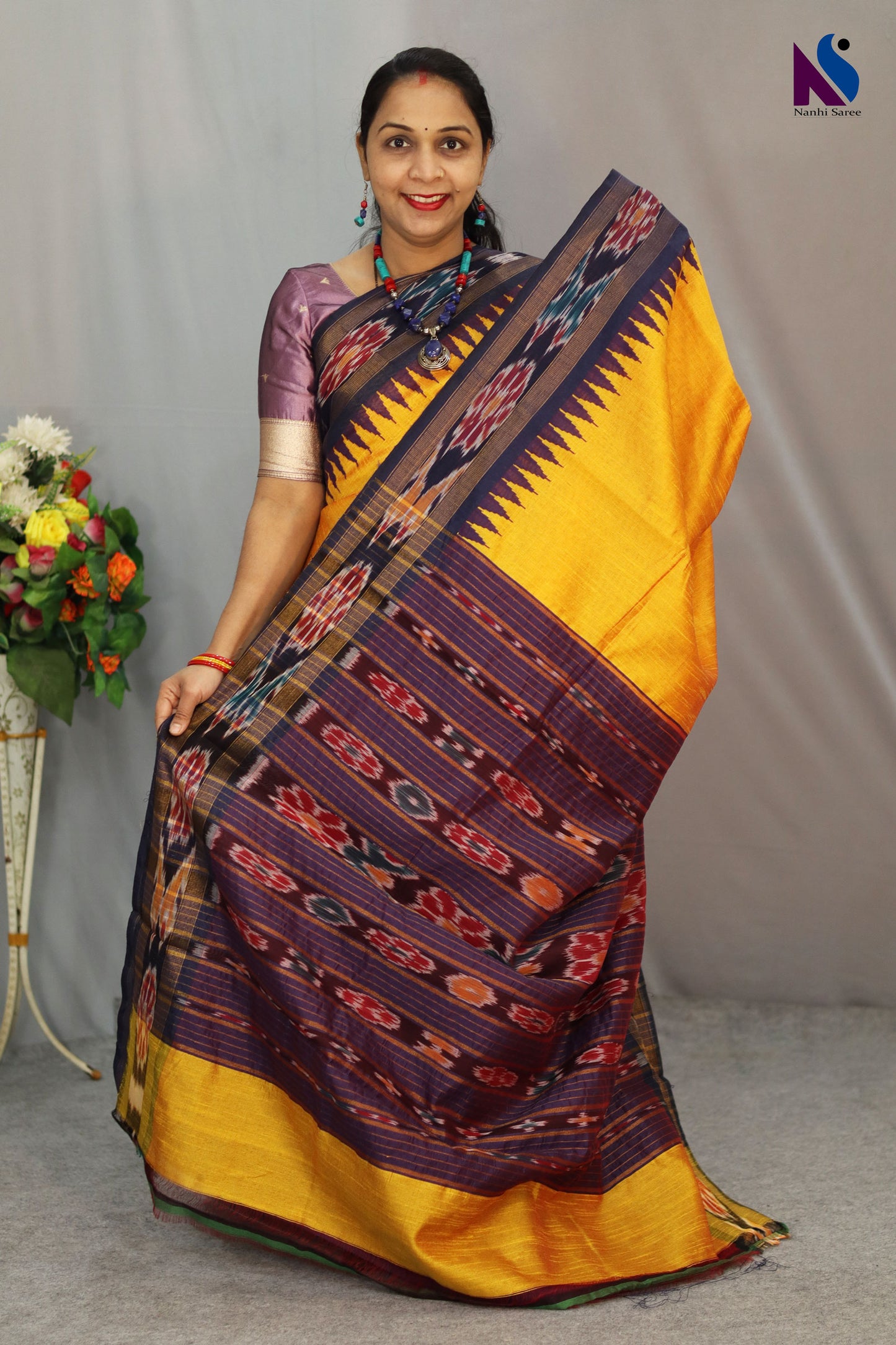 Vibrant rich yellow tones highlight the Pochampally handloom saree beautifully