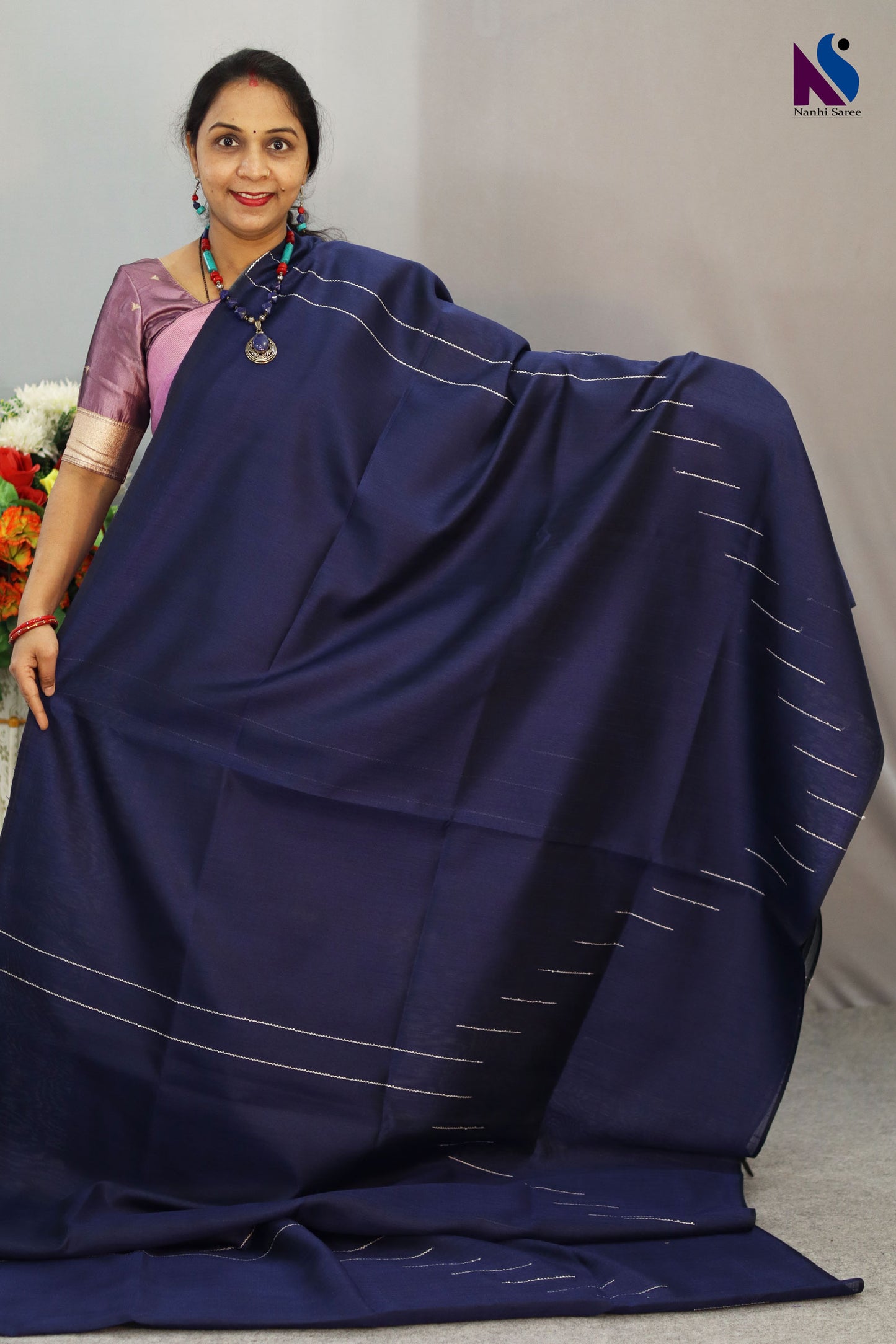 A handloom saree featuring rich navy blue tones and fine weaving