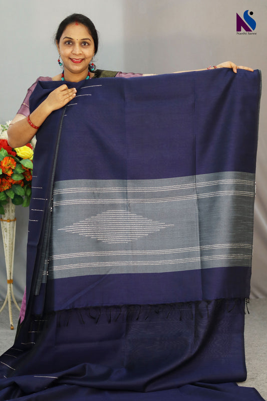 A handloom saree featuring rich navy blue tones and fine weaving