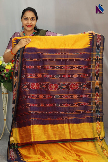 Vibrant rich yellow tones highlight the Pochampally handloom saree beautifully