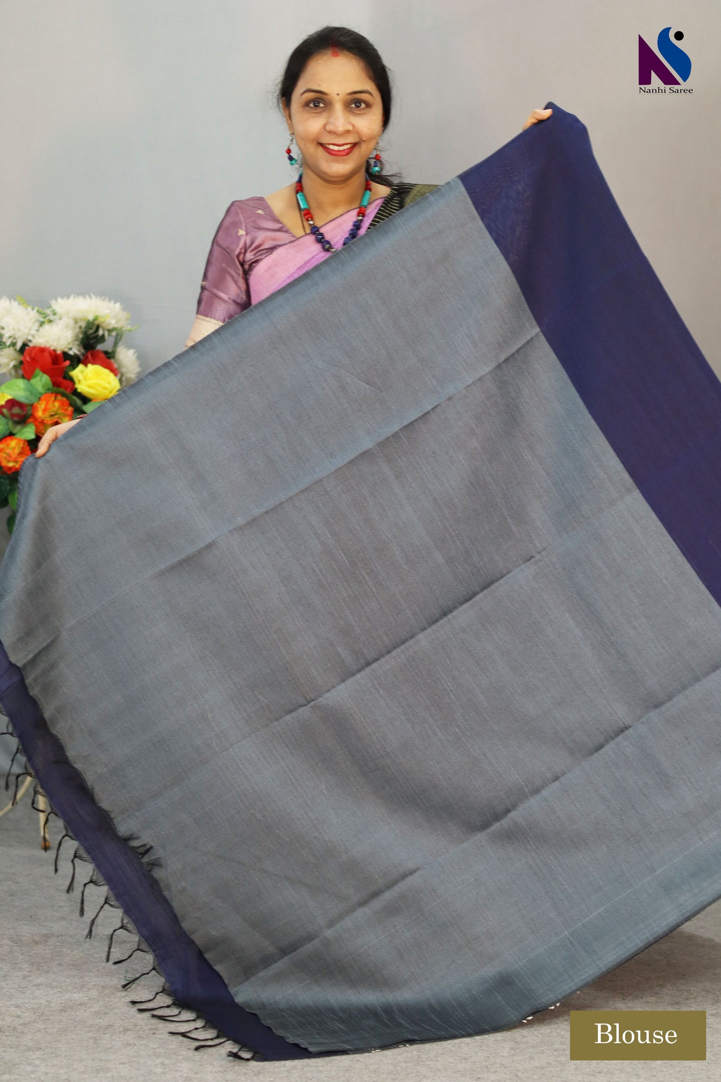 A handloom saree featuring rich navy blue tones and fine weaving