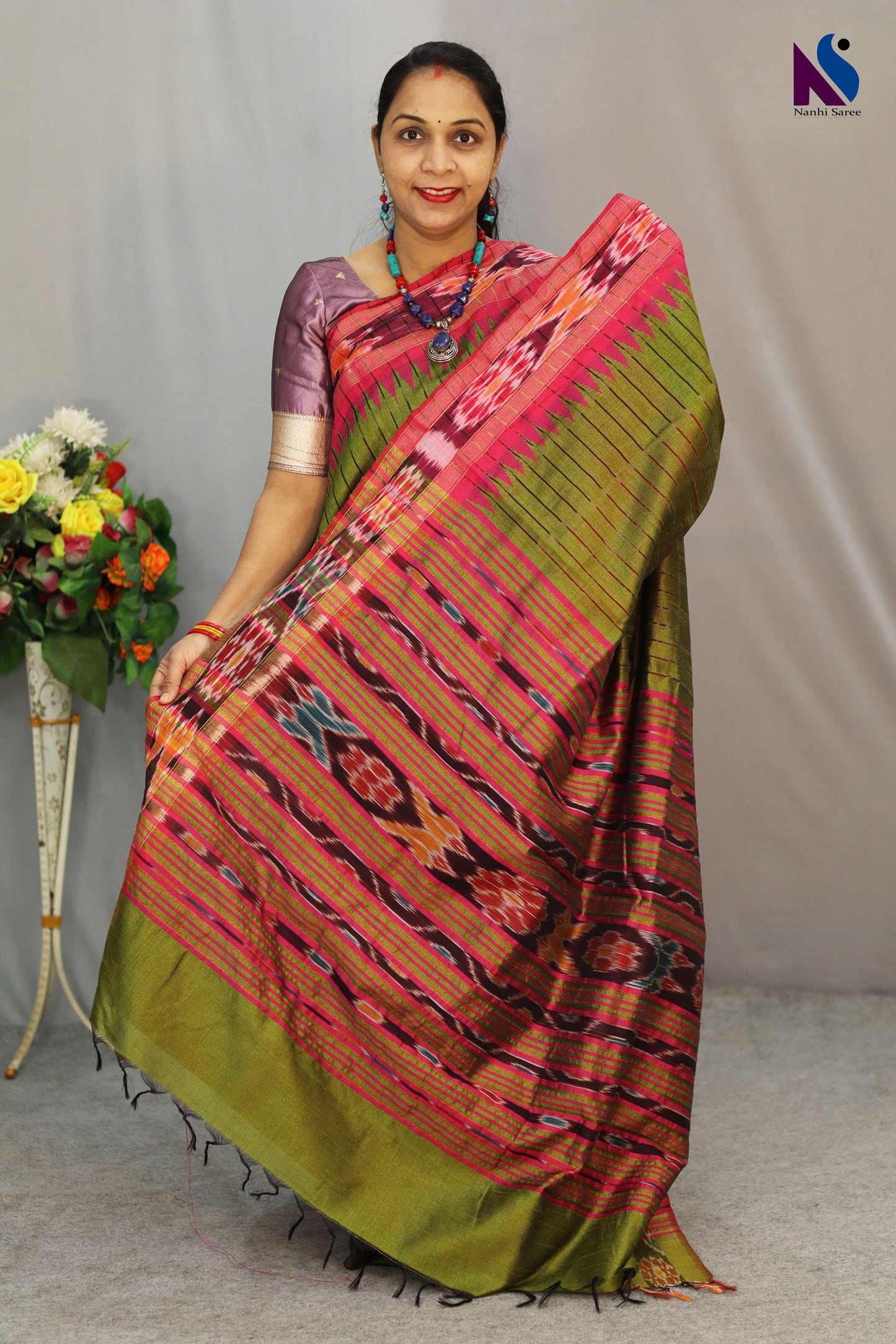 Subtle mehendi tones highlight the elegance of this Pochampally handloom saree