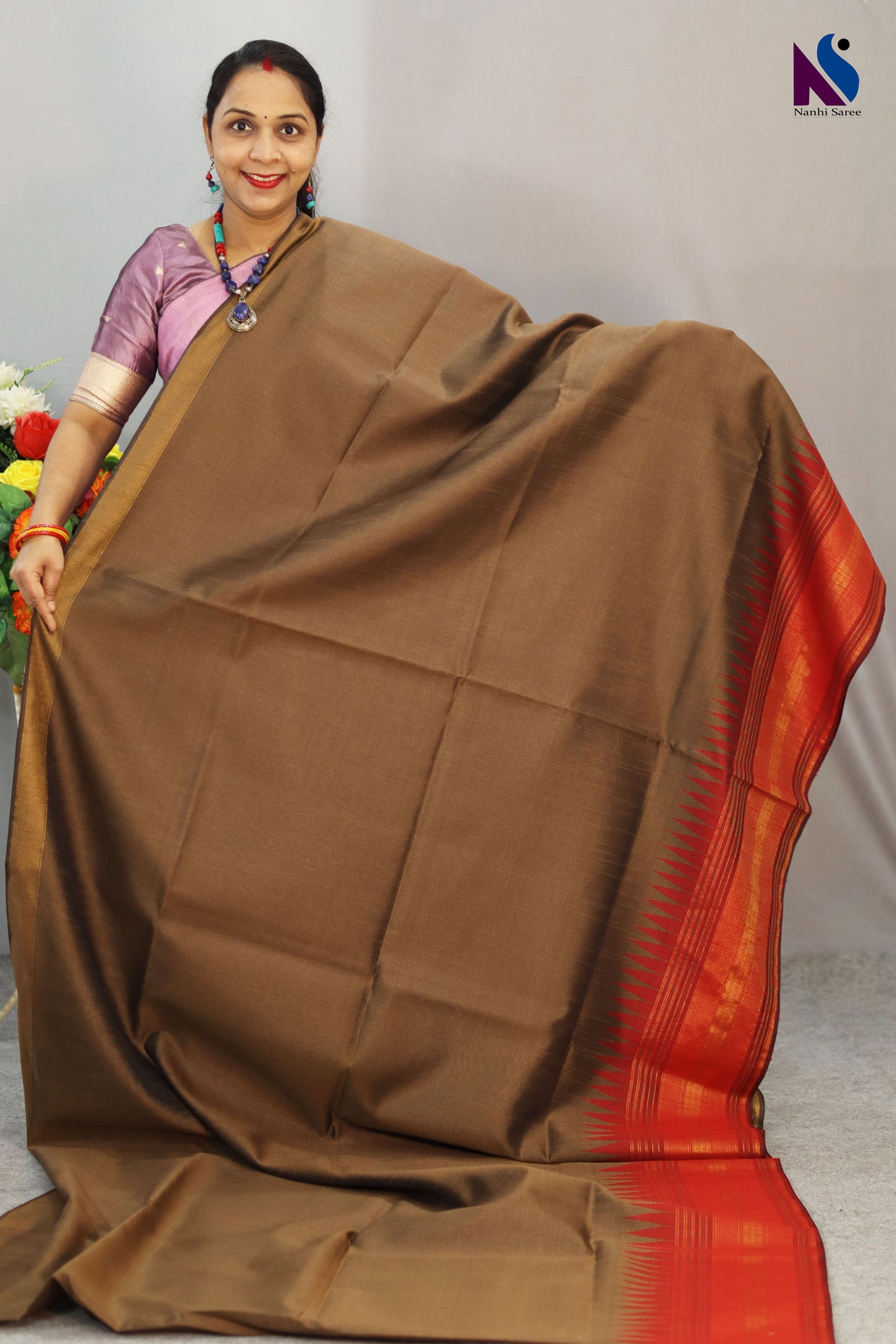 Soft earthy tones and gentle weave define this light brown handloom saree