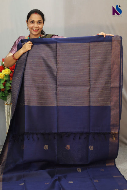 Rich navy blue color blended with timeless handloom artistry saree