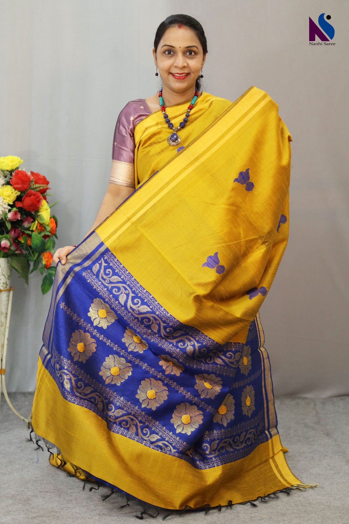 Vibrant yellow and blue tones paired with elegant handloom craftsmanship saree