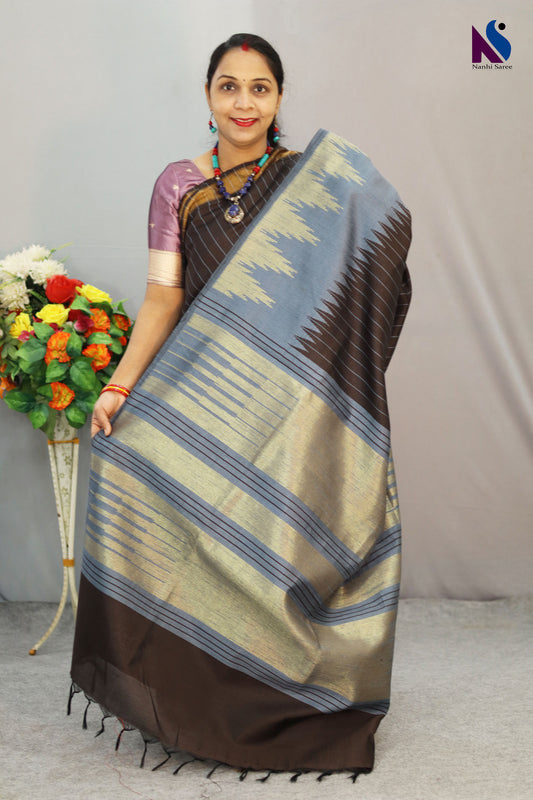 Timeless coffee shade paired with delicate craftsmanship in handloom saree