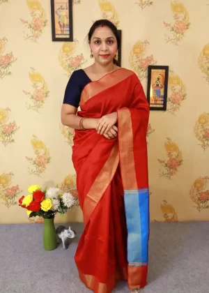 "Vibrant red art silk saree with beautifully crafted pallu."
