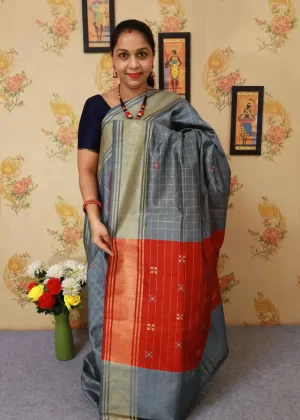 "Hand-woven saree, crafted with elegance in grey."