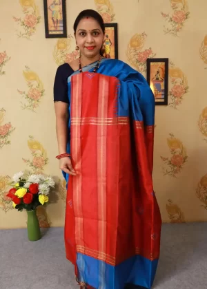 "Elegant light blue hand-woven saree, crafted with fine artistry."
