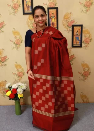 Handcrafted saree, radiating timeless elegance in red."