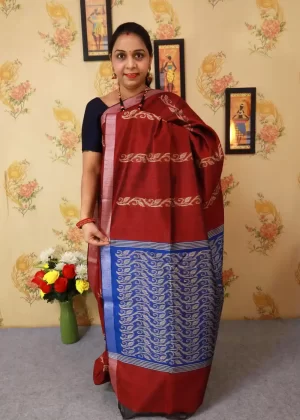 "Wine red hand-woven saree, a timeless blend of luxury and tradition."