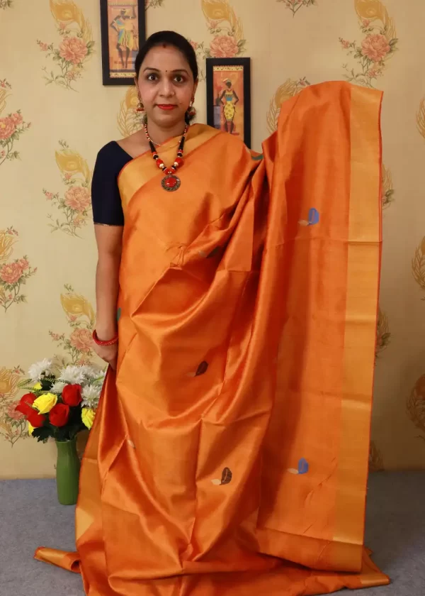 "Light orange hand-woven saree, radiating elegance and tradition." - Image 2