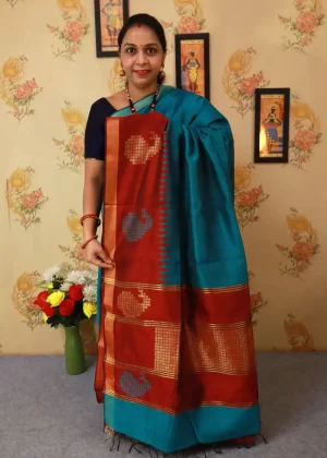 "Hand-woven saree, crafted with elegance in tropical teal colour."