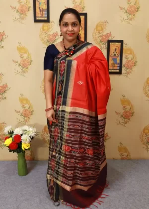 Soft red hand-woven saree, a perfect blend of tradition and grace."