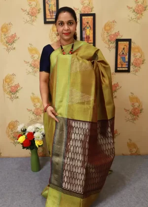 Graceful hand-woven saree, shining in lemon yellow."