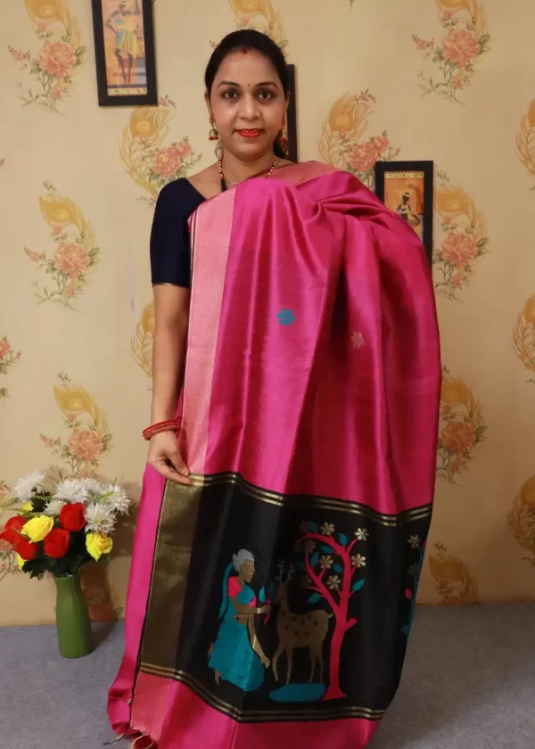 "Beautiful pink hand-woven saree, crafted with fine artistry."