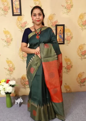 "Dark forest green art silk saree with elegant pallu design."
