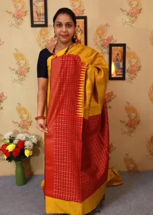 "Elegant yellow hand-woven saree, crafted with intricate artistry."