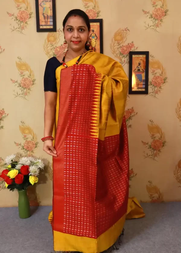 "Elegant yellow hand-woven saree, crafted with intricate artistry."